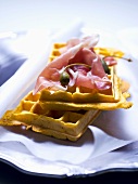 Waffles with raw ham and capers