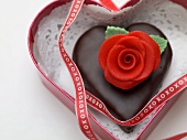 Chocolate heart with marzipan rose to give as a gift
