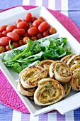 Pizza pinwheels with lettuce and tomatoes