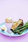 Soft-boiled egg, toast solders and green asparagus