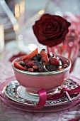 Hot berries with chocolate sauce for Valentine's Day