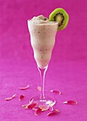 Kiwi and strawberry smoothie in champagne glass