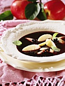 Elderberry soup with semolina dumplings and apple
