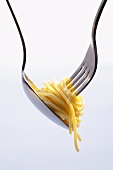 Twisting spaghetti with spoon and fork