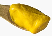 Mustard on a wooden spoon