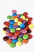 Chocolate beans with coloured sugar glaze