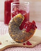 Plum and caramel jam on a poppy seed croissant