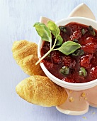 Strawberry, basil and red wine jam in a small bowl