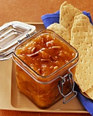 Apricot jam with pine nuts in jar