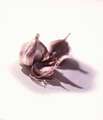 A garlic bulb with a clove broken off