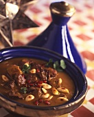 Lamb in a tajine with almonds and pomegranate seeds