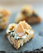 Slice of ciabatta topped with blue cheese and turkey