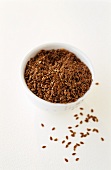 Linseed in and in front of a small bowl