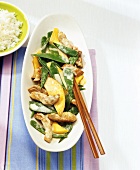 Strips of pork with mango and mangetout