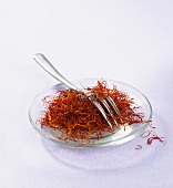 Spanish saffron threads on a glass plate