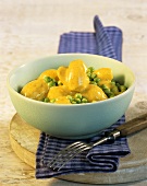 Potatoes with peas & curry cream sauce cooked in microwave