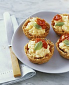Scrambled egg in kataifi nests with baked tomatoes