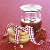 A pile of biscuits with strawberry jam