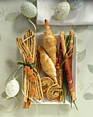 Puff pastries and grissini with raw ham for Easter