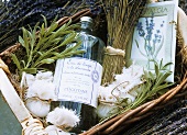 Lavender water, scented bags and dried lavender in basket