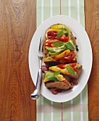 Pizza meatloaf (topped with peppers, onions and tomatoes)