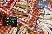 Various types of salami on a market stall (Grimaud, France)