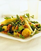 Smoked fish salad with potatoes and green asparagus