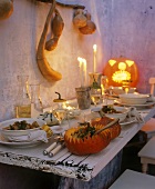 Pumpkin stew on table laid for Halloween