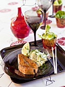 Grilled salmon cutlet with potato salad