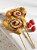 Heart-shaped raspberry cake lollipops