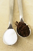 A spoonful of ground coffee and a spoonful of sugar