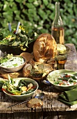 Wild herb dishes on wooden table