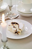 Meringue roll filled with sweet mincemeat and brandy cream