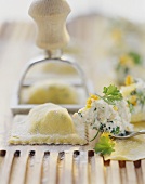 Homemade ravioli with fresh cheese and herb filling