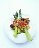 Green asparagus with stewed tomatoes, olives and capers