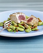 Fried tuna with broad beans and strips of ham