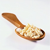 Cooked wheat on a wooden spoon