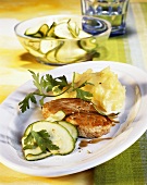 Pork escalope with mashed potato and courgette salad