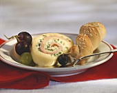 Bohemian cheese roulade with grapes and sesame plait