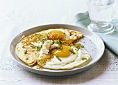 Fried eggs with duka, mint and sheep’s cheese