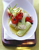 Leeks stuffed with ricotta with tomatoes