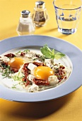 Fried egg with dried tomatoes and sheep's cheese