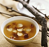 Raw fish soup with ginseng and dates