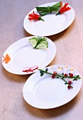 Three plates with vegetable decorations