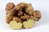 Several potatoes, variety 'Pink Fir Apple', whole and halved