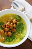 Chicken soup with toasted chick-peas and basil