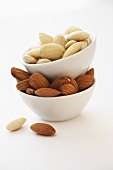 Shelled almonds in piled-up bowls