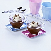 Chocolate puddings with blobs of cream