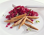 Home-made black bread noodles with red cabbage