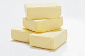 Four pieces of butter in a pile